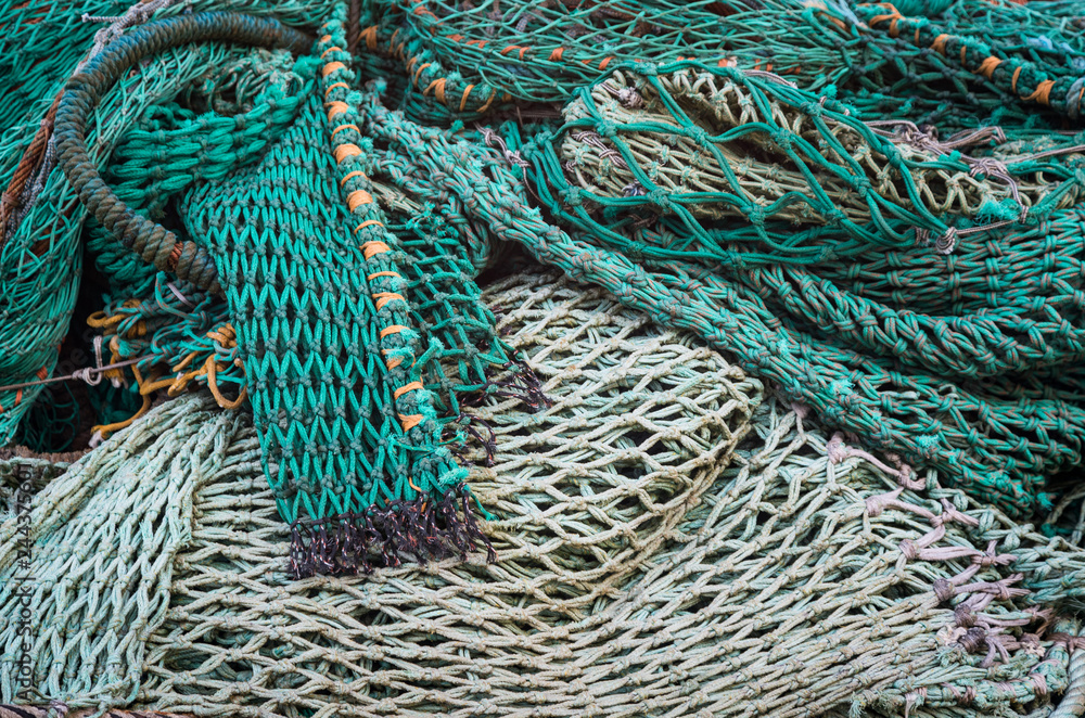 close up on Pile of various fishing nets on a dock