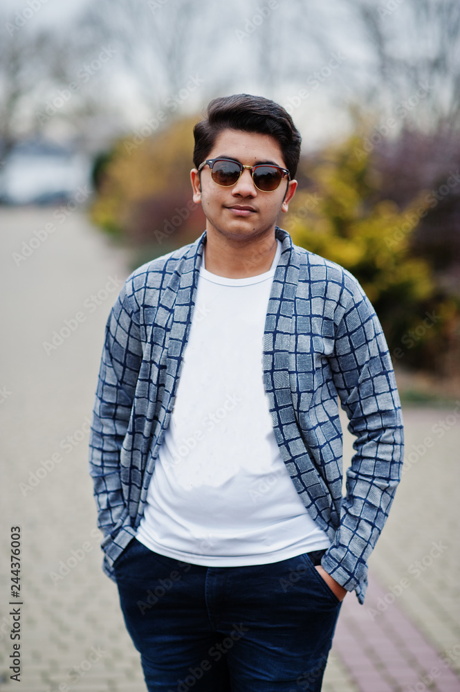 Stylish indian young man at sunglasses wear casual posed outdoor. Stock  Photo | Adobe Stock