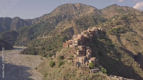 Stunning 4k cinematic drone aerial footage of abandoned ghost town of Roghudi Vecchia, Calabria, Italy.