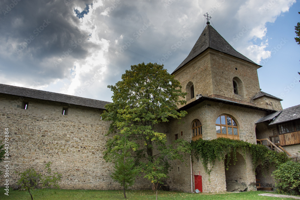 Fototapeta premium Vatra Moldovitei, Romania, Moldovita Monastery,September ,2017,inner yard,defensive wall