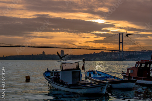 Istanbul, Turkey, 22 March 2006: Sunset, Boats and Bosphorus Bridge, Cengelkoy