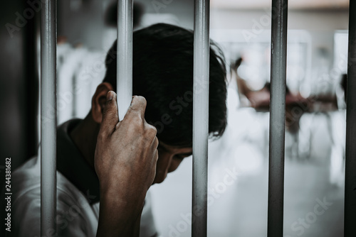 Obraz na plátne Hands of men desperate to catch the iron prison,prisoner concept,thailand people,Hope to be free