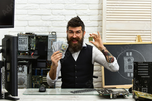 We will do the mining for you. Bitcoin miner man in server room. Bearded businessman with computer circuits and dollars. Bearded man bitcoiner. Virtual currency. Crypto currency mining hardware photo