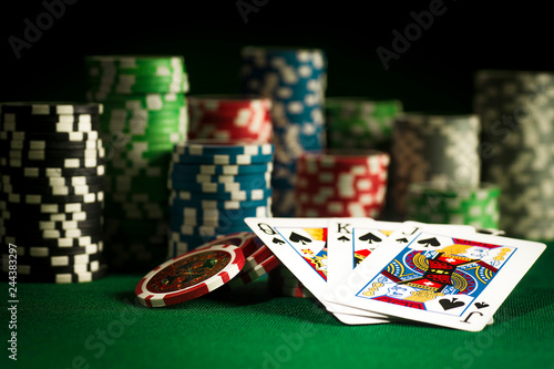 Gambling concept - Cards on chips background