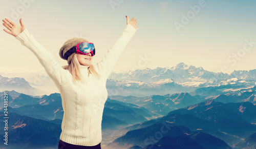 Young sporty woman in ski glasses. Outdoors.