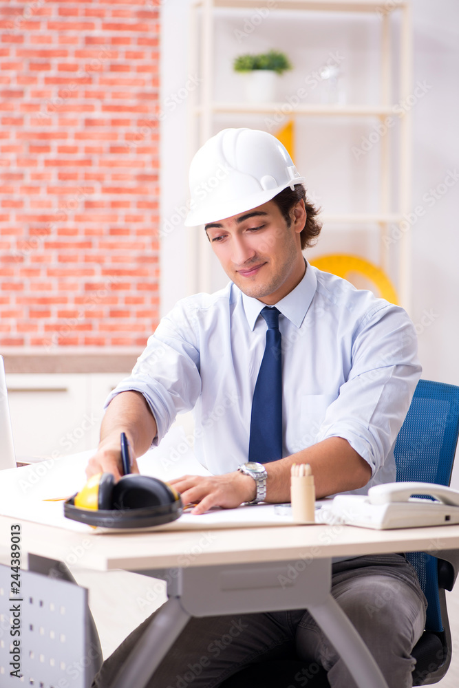 Construction supervisor working on blueprints Construction supervisor working on blueprints