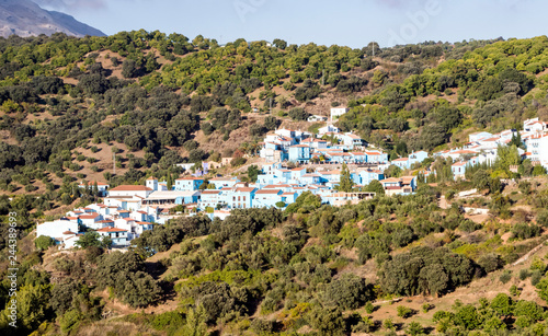 Village of white houses in the Sierra de Malaga, in Spain, on a sunny day.