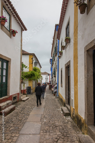 Obidos, Portugal, June 15, 2018: Street trade on the narrow street of the old town of Obidos