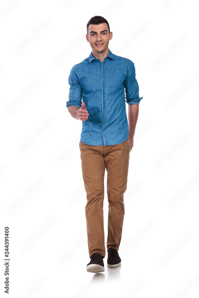 relaxed casual man walking forward and making ok sign relaxed casual man walking forward and making ok sign