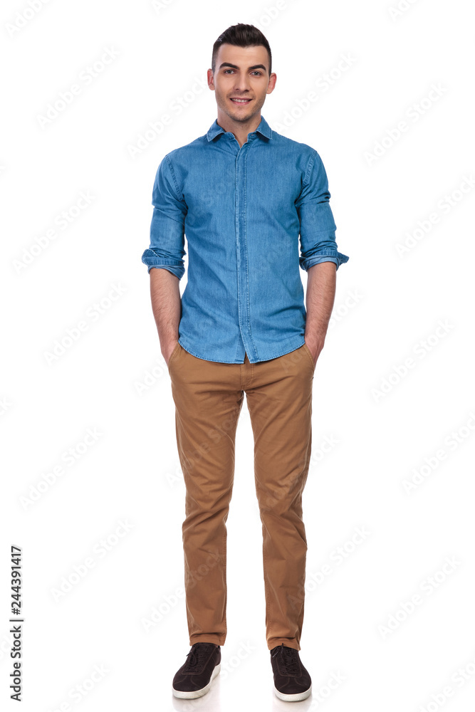 Fototapeta premium relaxe casual man standing with hands in pockets
