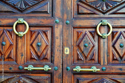 wooden door with lock and knocker