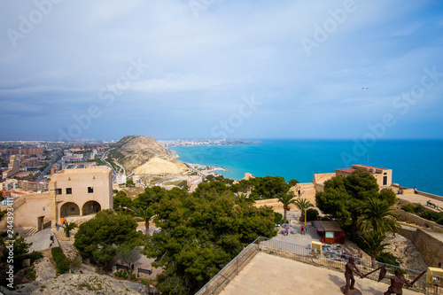 Wide angle view of Alicante, Spain from Santa Barbara Castle. Panoramic view of the city, the harbor and the hills. Place to visit citizens and tourists