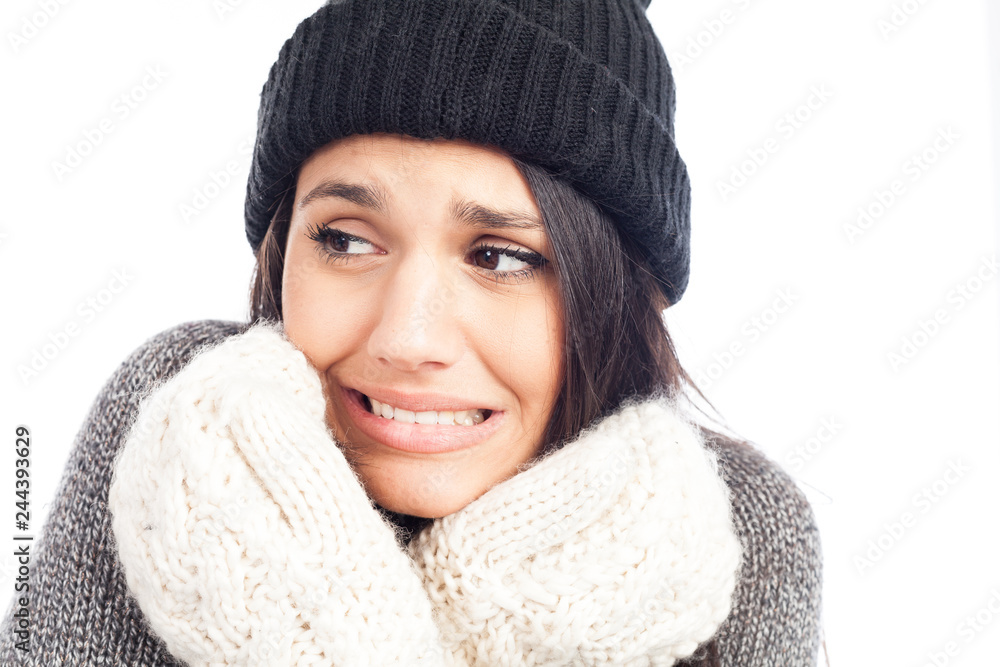pretty brunette woman with a woolen hat a sweater and gloves that has cold pretty brunette woman with a woolen hat a sweater and gloves that has cold