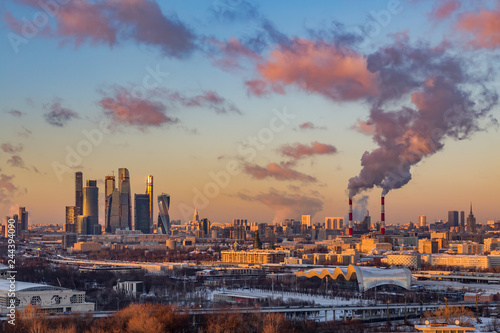 Moscow international business center  Moscow-city . Smoke from the pipes of the combined heat and power plant. Winter evening cityscape.