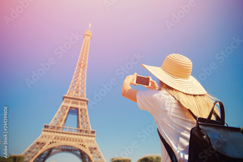 Girl tourist Eiffel tower making selfie. Beautiful European enjoying vacation in Paris, France. Concept travel © Parilov