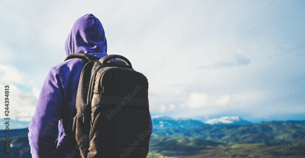 tourist traveler with black backpack on background top mountain, traveler look at blue sky clouds, hiker enjoying nature panoramic landscape in trip, relax holiday mockup concept in trekking trip tourist traveler with black backpack on background top mountain, traveler look at blue sky clouds, hiker enjoying nature panoramic landscape in trip, relax holiday mockup concept in trekking trip