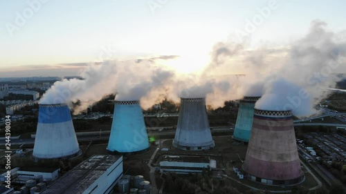 Power plant block. Cooling tower. Water vapor rises to the sky. Footage. Aerial view. Sunrise and fog. 4K. photo