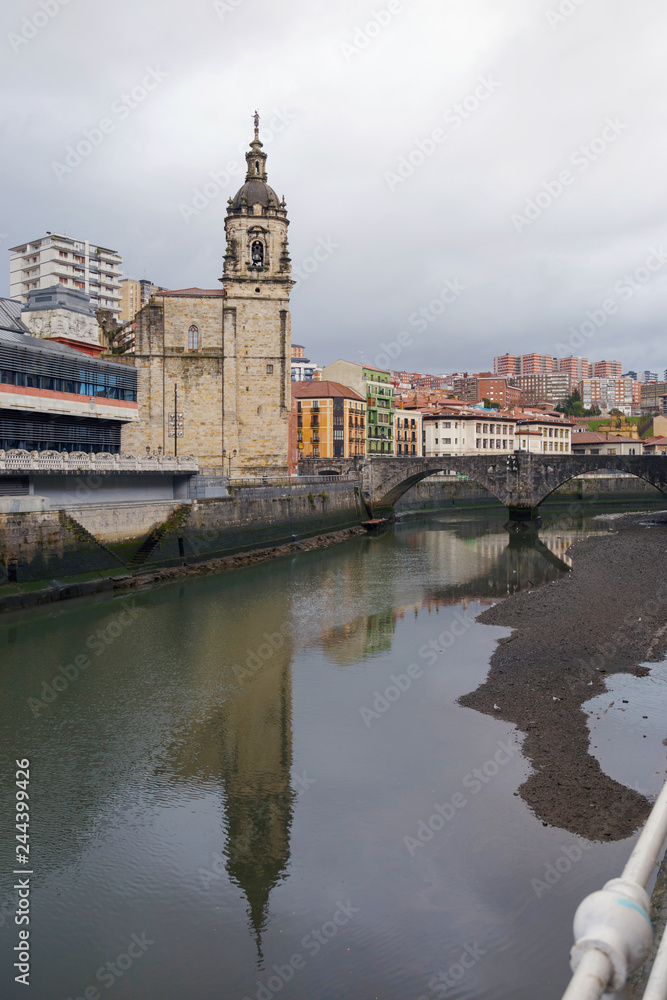 San Anton church and the Ribera market, in the old town of Bilbao, Basque Country, Spain. On a cloudy day.