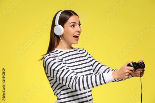 Emotional young woman playi...