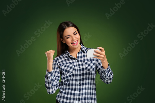 Emotional young woman playi...