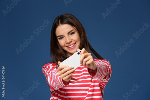 Beautiful young woman playi...