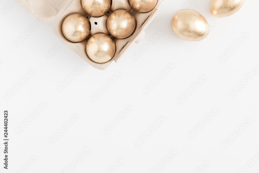 Easter golden eggs, easter decorations on white background. Flat lay, top view, copy space Easter golden eggs, easter decorations on white background. Flat lay, top view, copy space