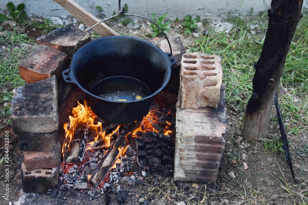 romanian cauldron (ceaun) with oil on the fire romanian cauldron (ceaun) with oil on the fire