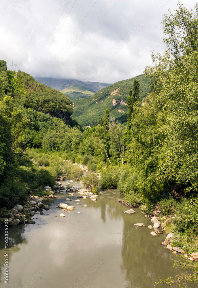 River in the Pyrenees in the Benasque valley in Spain on a sunny day.