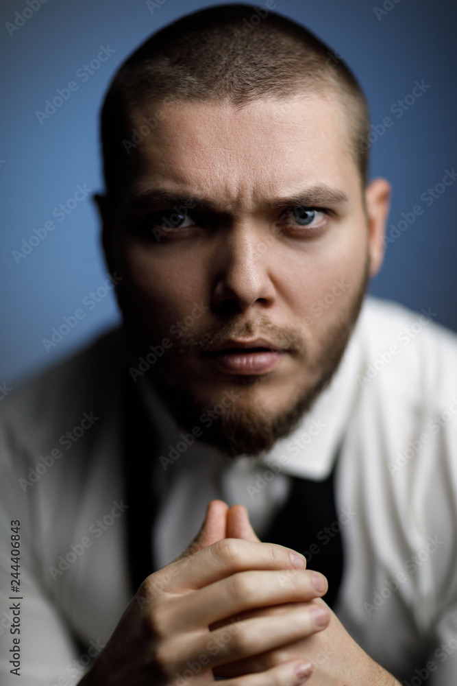 young bearded man in a white shirt and bow tie young bearded man in a white shirt and bow tie