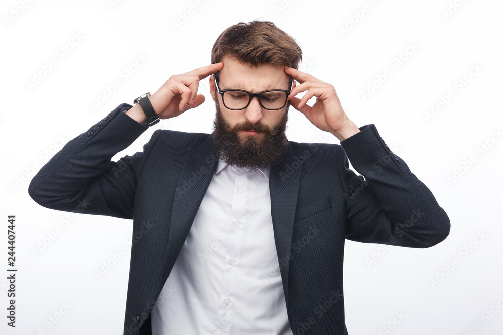 Stressed businessman rubbing temples Stressed businessman rubbing temples