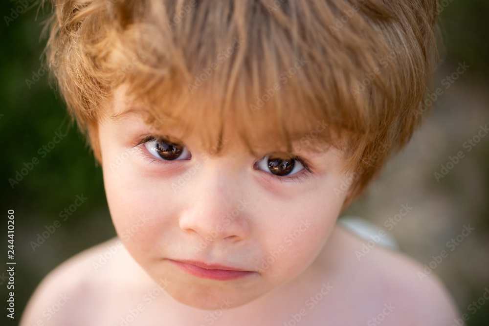Sad upset boy. Frustrated child. Child sadness. Beautiful baby face with big eyes. Smart boy looking at camera. White boy with brown eyes close up. Frustration. Sad upset boy. Frustrated child. Child sadness. Beautiful baby face with big eyes. Smart boy looking at camera. White boy with brown eyes close up. Frustration.