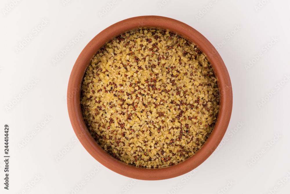 bowl of raw bulgur and quinoa isolated on white background, top view bowl of raw bulgur and quinoa isolated on white background, top view
