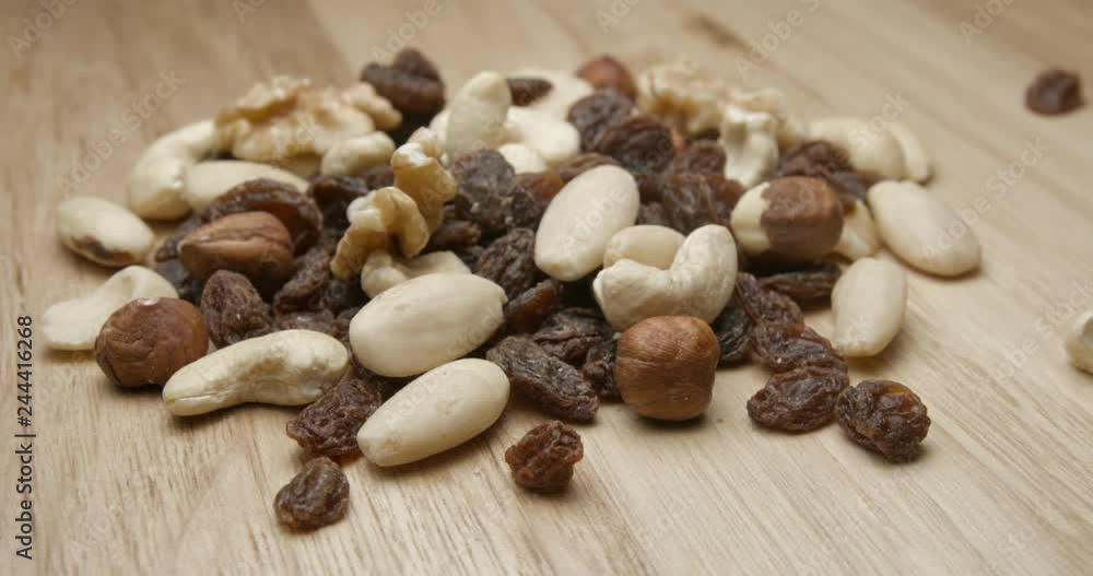 Dried fruits falling and rotating studio macro Dried fruits falling and rotating studio macro