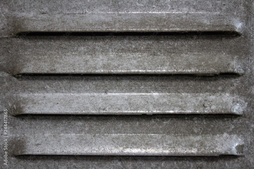 Dust-laden vent opening on an old ferrous closet.. Dust-laden vent opening on an old ferrous closet..