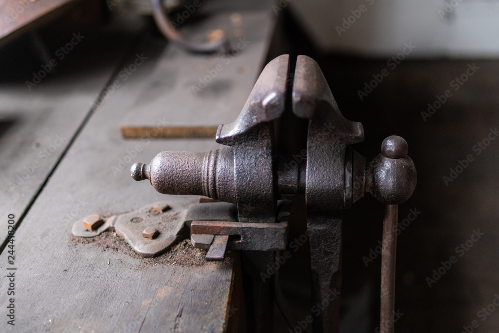 Vintage tools on a bench lit by a window, vice, gunsmith, gun, smith,  blacksmith, classic, rusty, colonial era Stock Photo | Adobe Stock