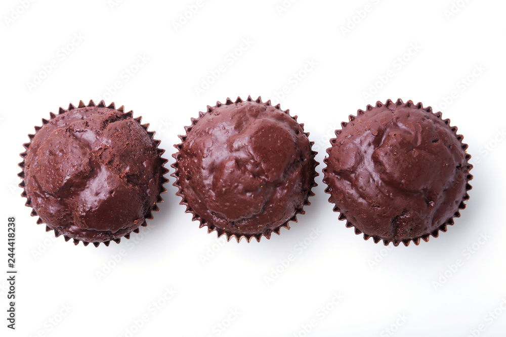 Assorted with Delicious homemade cupcakes with raisins and chocolate isolated on white background. Muffins. Top view. Copy space. Assorted with Delicious homemade cupcakes with raisins and chocolate isolated on white background. Muffins. Top view. Copy space.