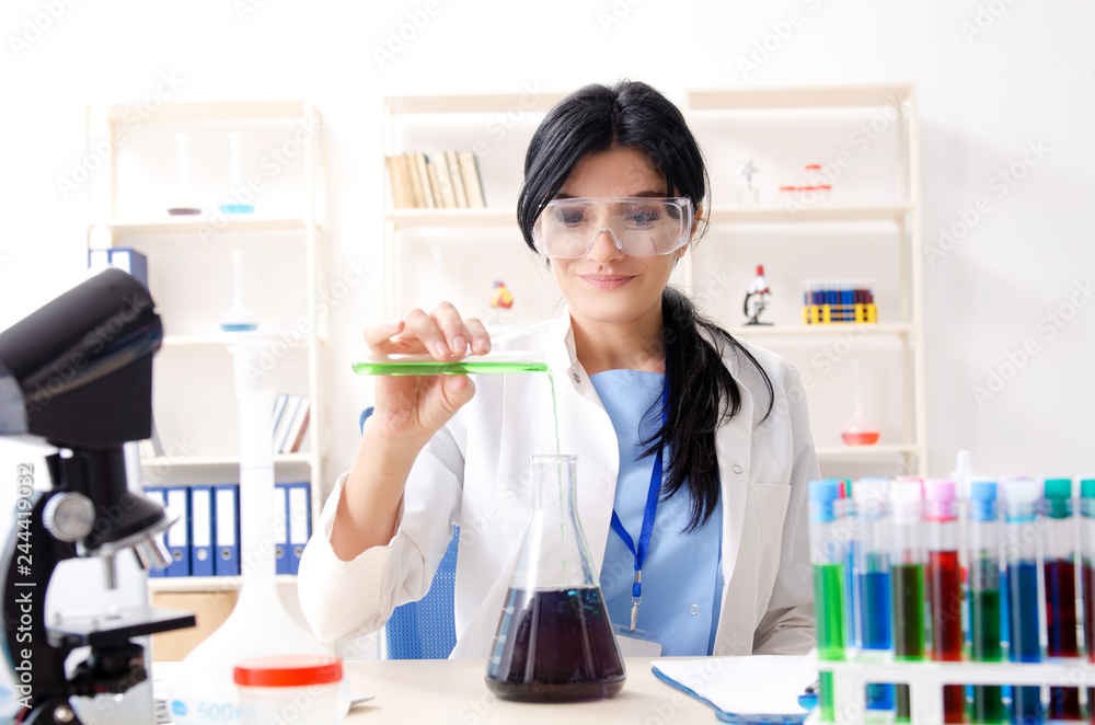 Female chemist working at the lab Female chemist working at the lab
