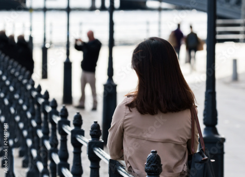 Photography asian woman by a river bank in stockholm