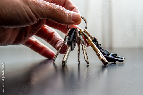Hand holding house keys