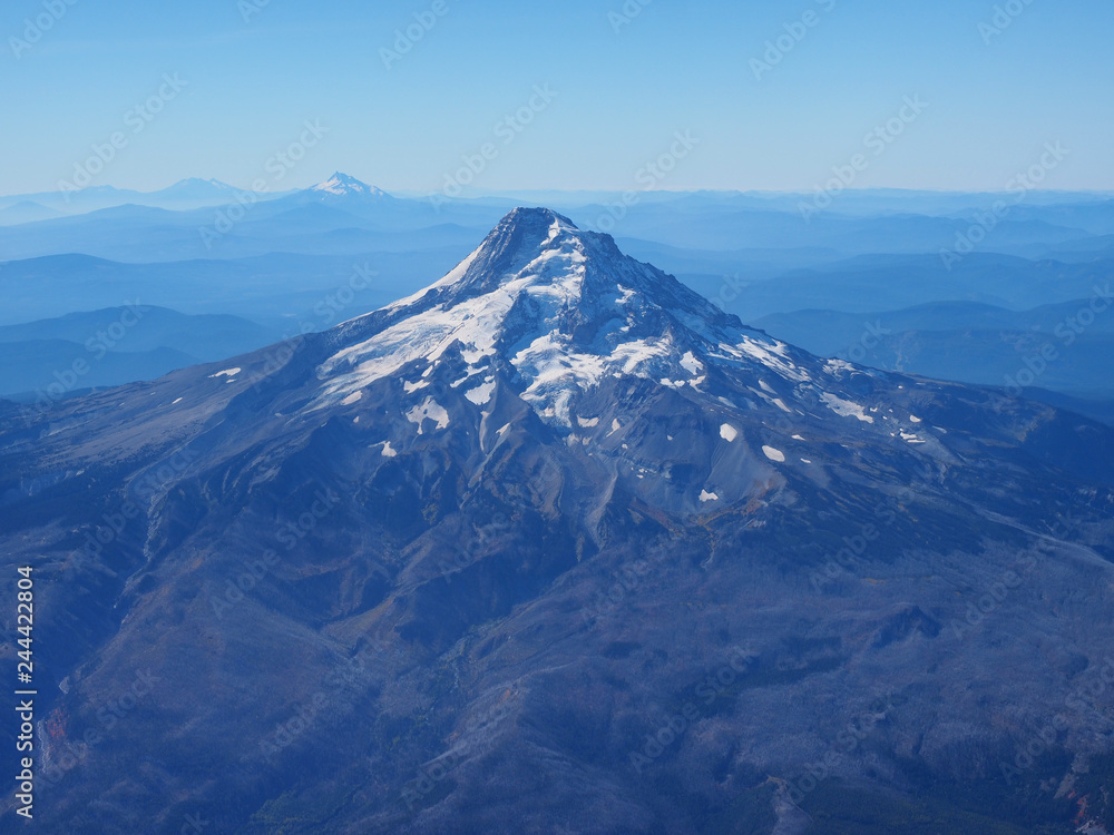 Mount Hood, Oregon, photographed from the airplane window on a flight into Portland on a clear, cloudless autumn day.