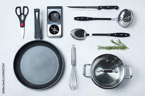 Flat lay composition with clean cookware on light background