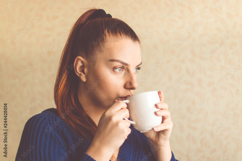 Young woman enjoying morning coffee Young woman enjoying morning coffee