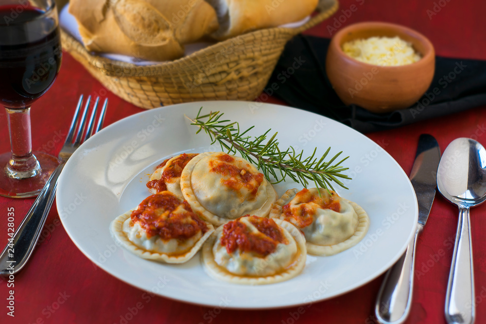 Making homemade pasta: Large round ravioli (Sorrentino) cooked, served on a dish, ready to eat Making homemade pasta: Large round ravioli (Sorrentino) cooked, served on a dish, ready to eat