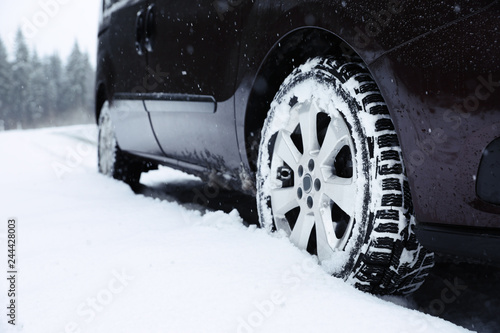 Closeup view of car on snowy winter day © New Africa