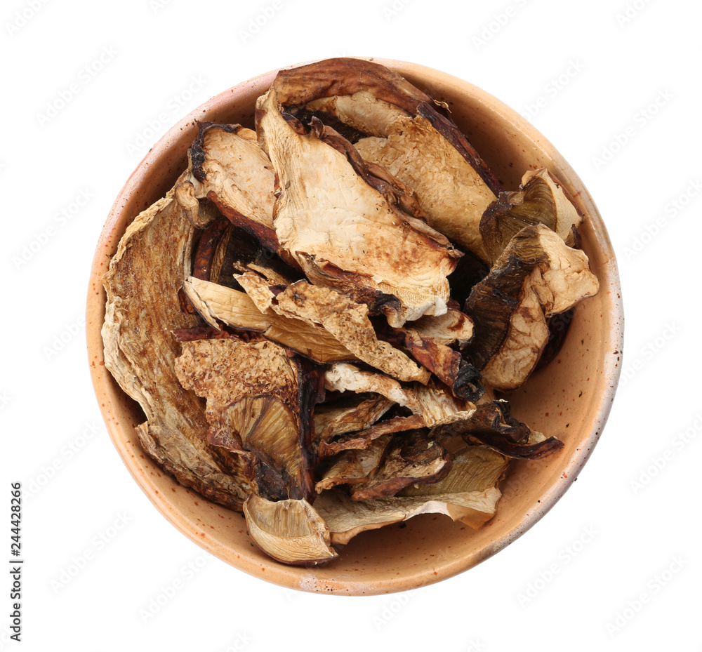 Bowl of dried mushrooms isolated on white, top view Bowl of dried mushrooms isolated on white, top view