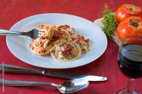 Making homemade pasta: Large round ravioli (Sorrentino) cooked, served on a dish, ready to eat