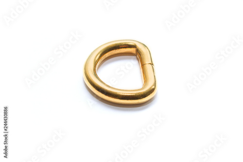Metal half ring of golden color isolated on white background. Fittings. View from above