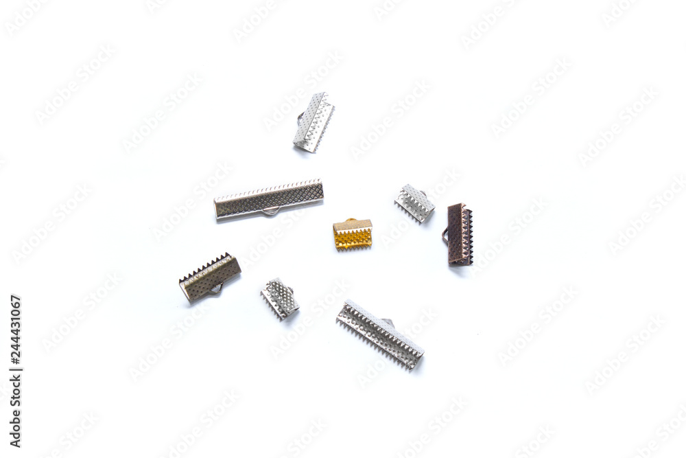 Metal clips for chokers from ribbons and lace. Fittings. View from above Metal clips for chokers from ribbons and lace. Fittings. View from above