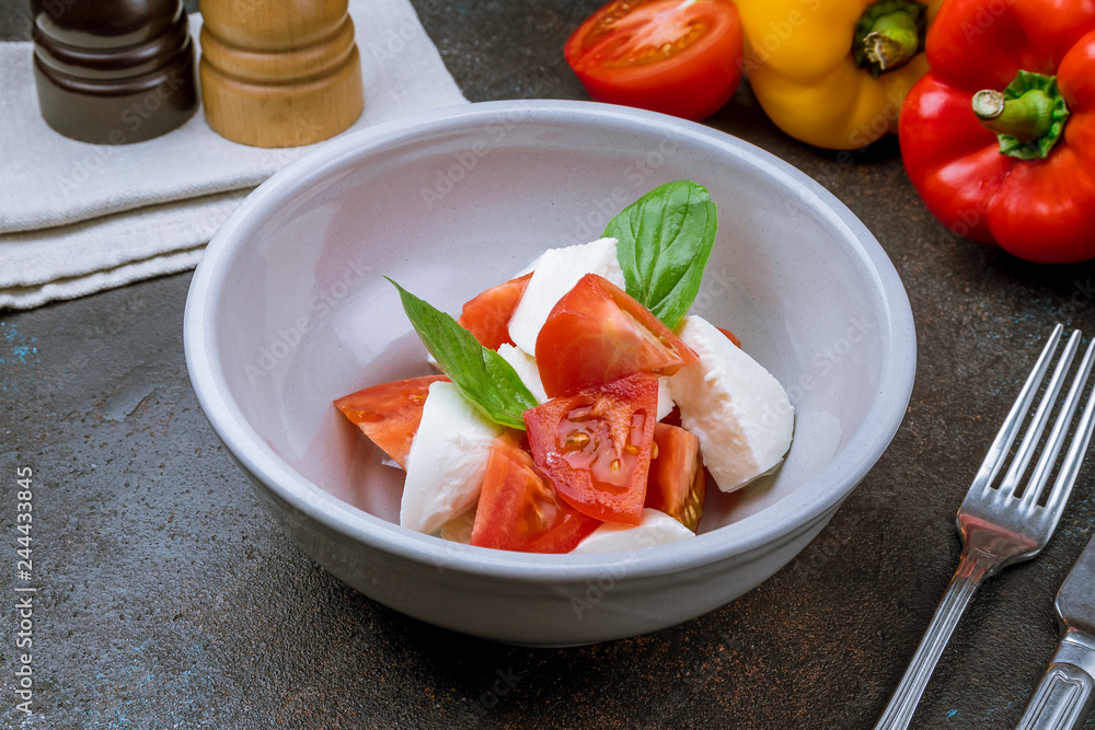 Caprese salad with mozzarella and tomato Caprese salad with mozzarella and tomato
