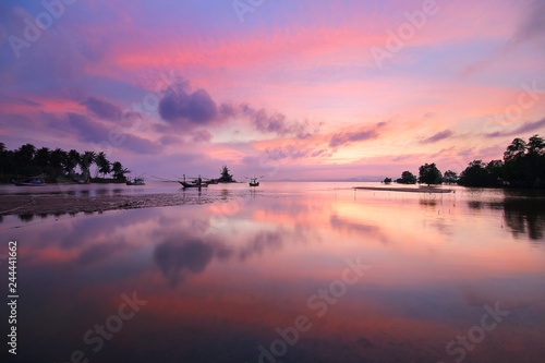 Natural background of the colorful sky and beautiful water reflection during sunset at Mae Ramphueng Beach  Prachuap Khiri Khan province in Thailand
